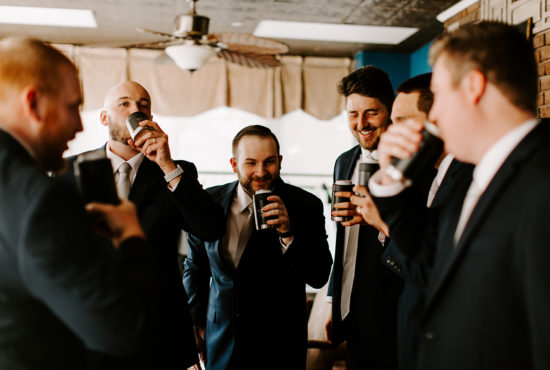 Groomsmen toast the groom