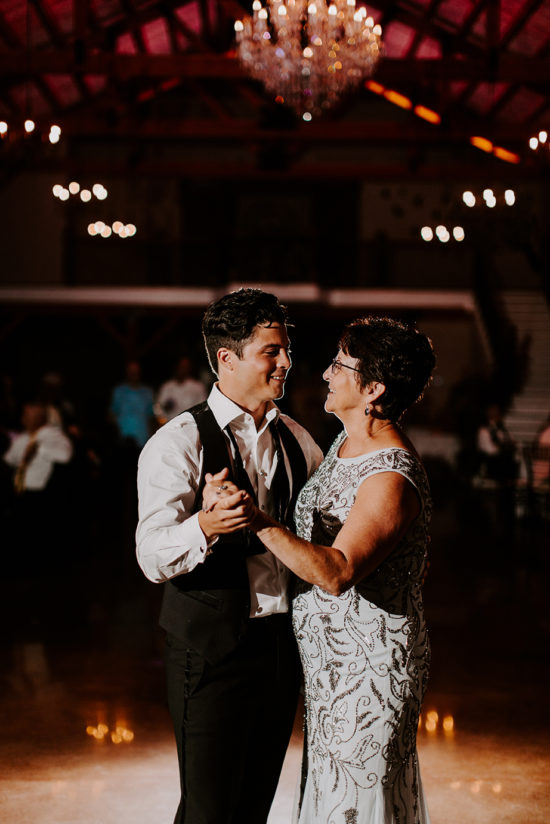 The groom dances with his mom