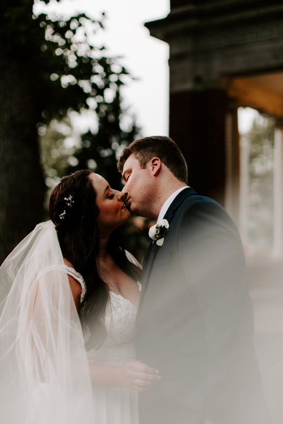 Newlyweds kiss at Loose Mansion wedding