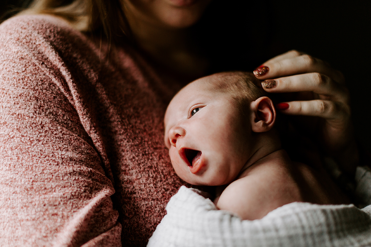 Newborn photography of yawning baby