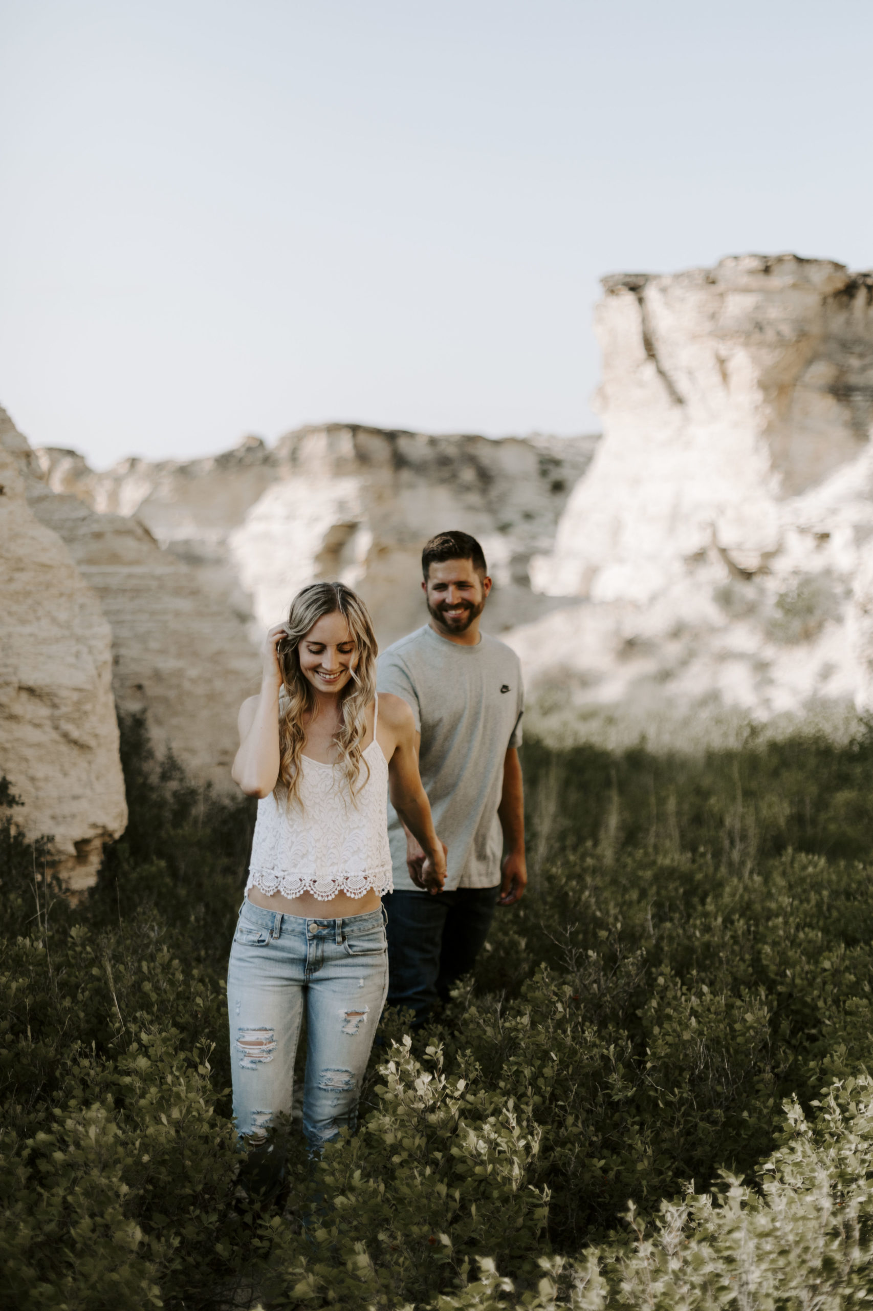 Couple holds hands for their Kansas engagement photos at Little Jerusalem