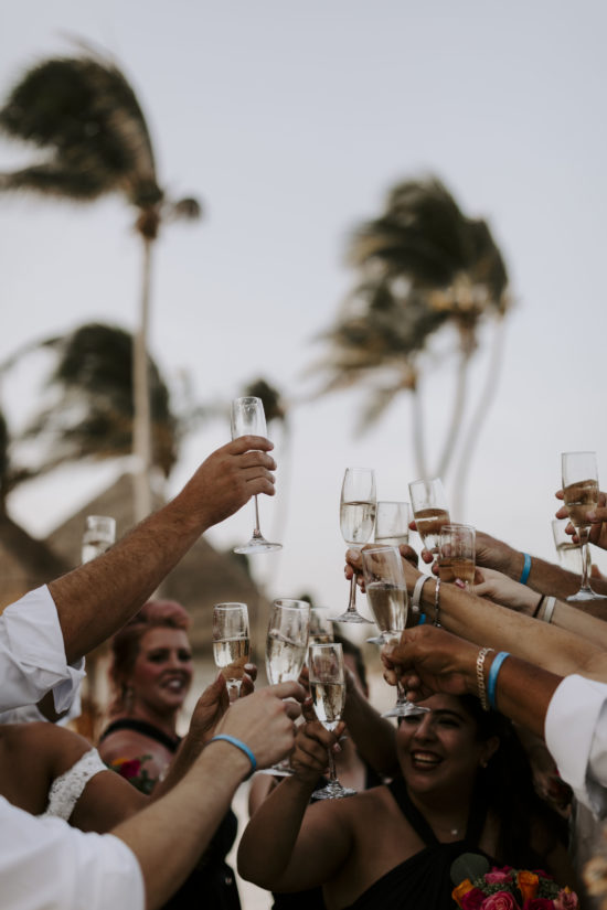 Wedding guests in Mexico toast to the bride and groom