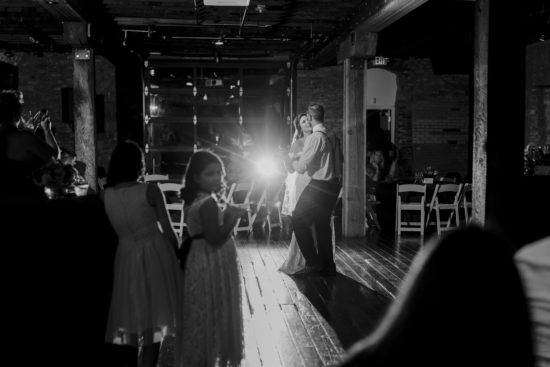 Bride and groom dance together at their reception