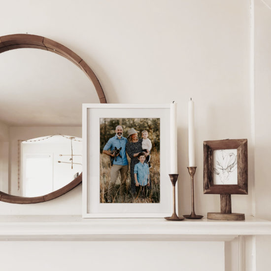 Framed photo sits on a mantle — a perfect gift for the holidays