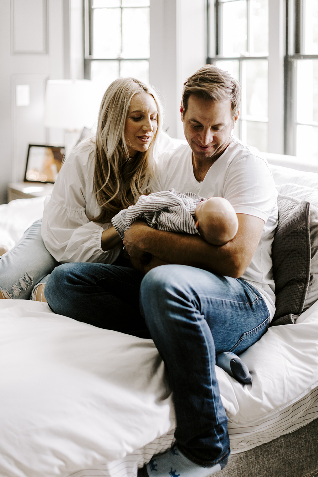The Roberts family snuggles their new baby during their Kansas City newborn session