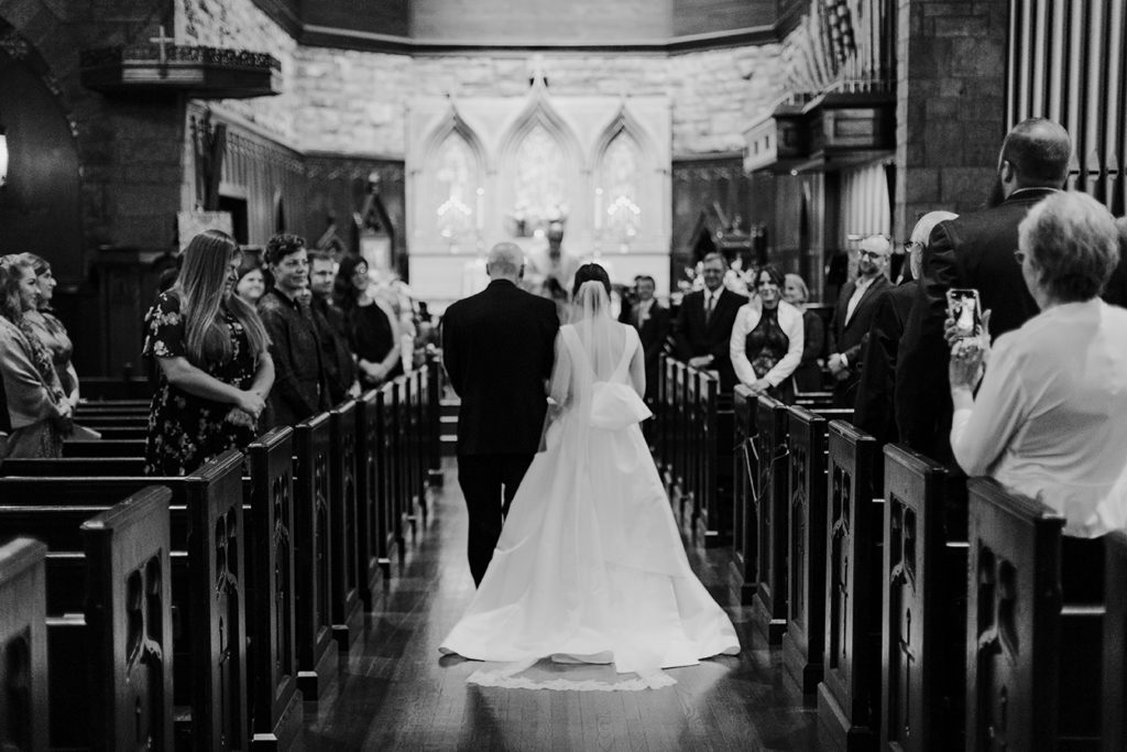 The bride and her father walk down the aisle at St. Paul's Episcopal Church.