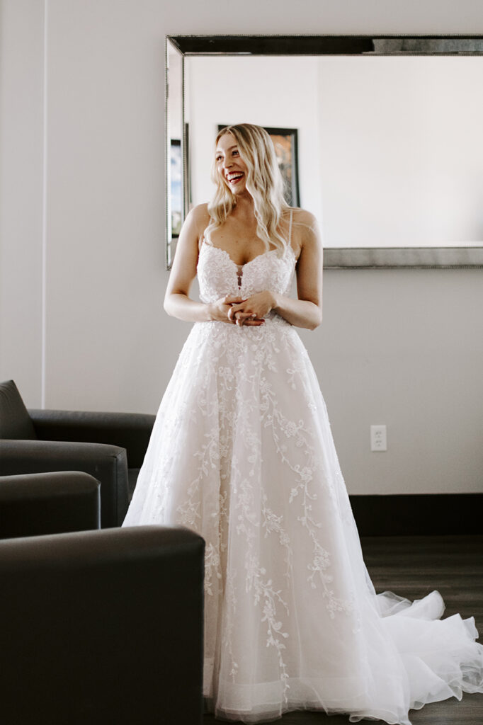 Michelle poses in her dress for her Oread wedding in Lawrence KS