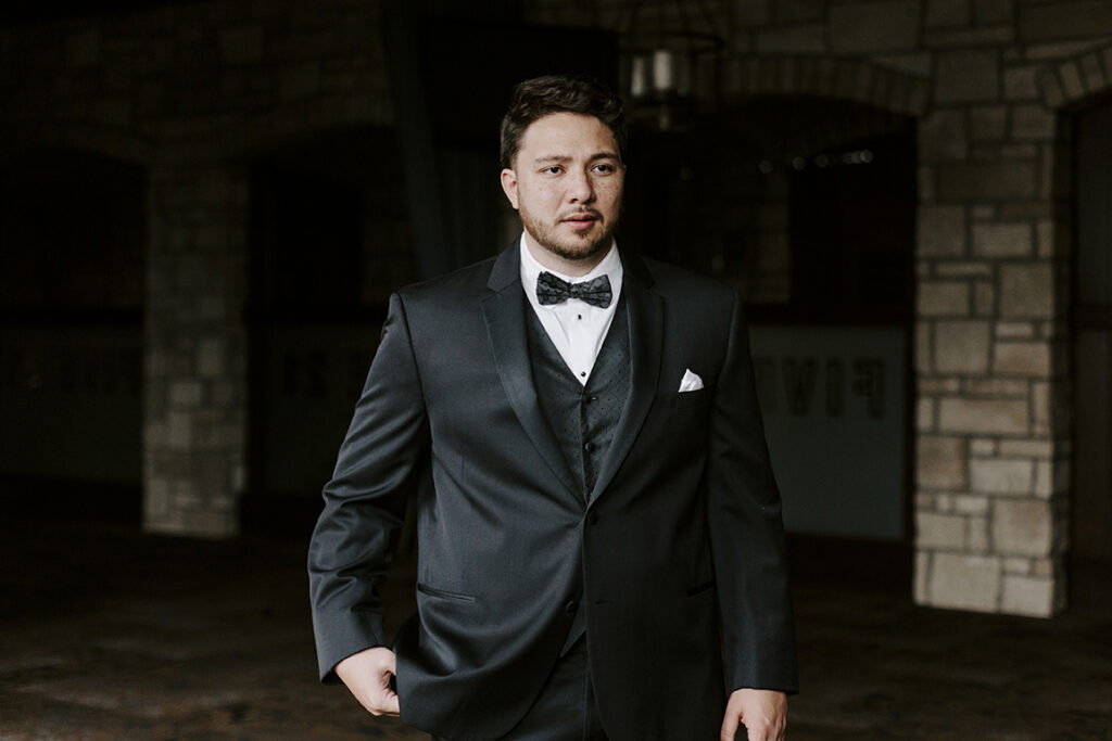 Sailor preps for his first look at his Oread wedding in Lawrence KS